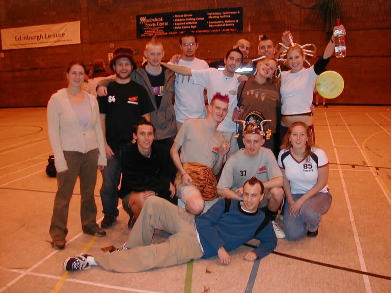 Energetic group celebrating at Mohawks Ultimate sports event in indoor basketball court.