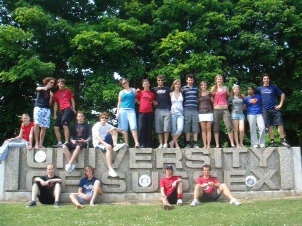 Group of young people enjoying Mohawks Ultimate event at university campus in summer.