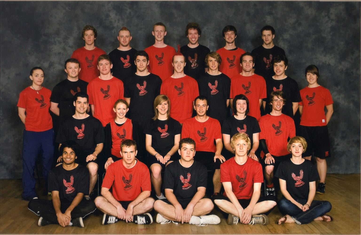 Team of young athletes wearing Mohawks Ultimate frisbee team gear, posing for a group photo.